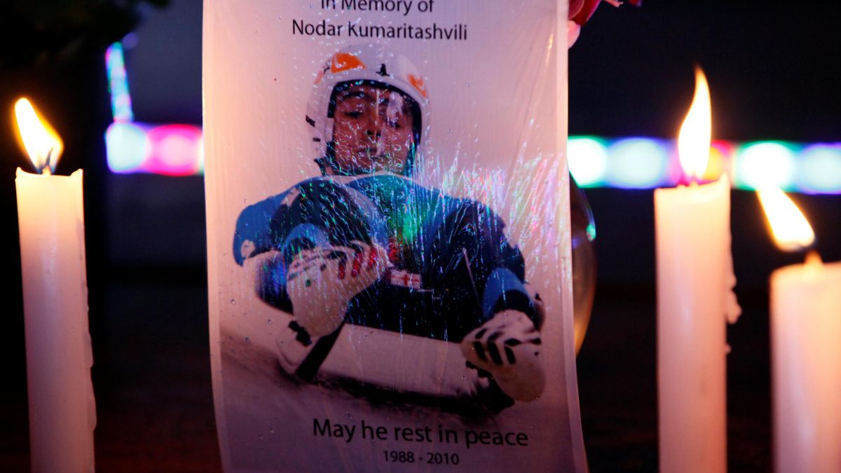2010 Winter Olympics Vancouver A postcard flanked by candles reads 'in memory of Nodar Kumaritashvili - may he rest in peace 1988-2010'