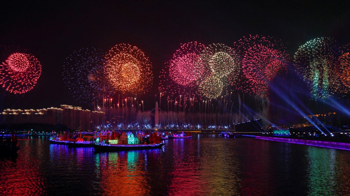 Fireworks explode at the Pearl river during the opening ceremony of the 16th Asian Games in Guangzhou