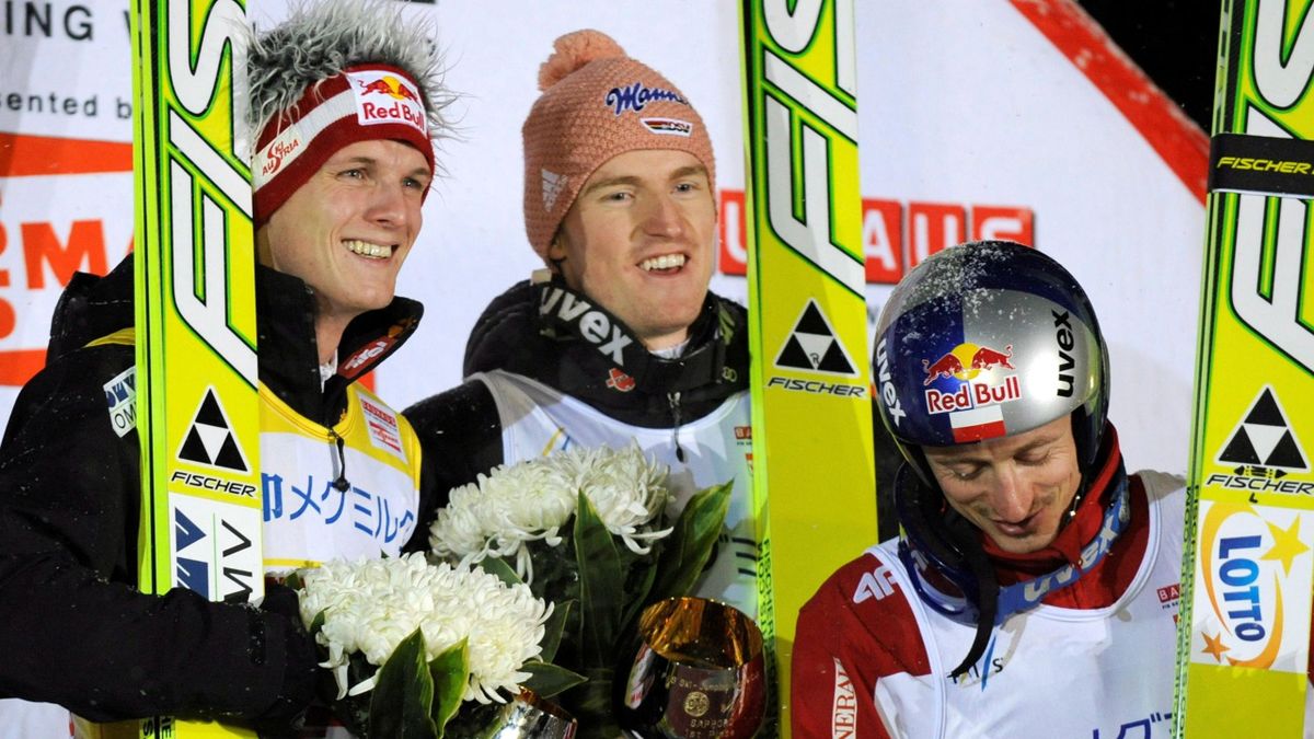 Severin Freund (C) of Germany celebrates with runner-up Thomas Morgenstern (L) of Austria and third-placed Adam Malysz of Poland after winning the FIS World Cup ski jumping in Sapporo, northern Japan, 15 January 2011