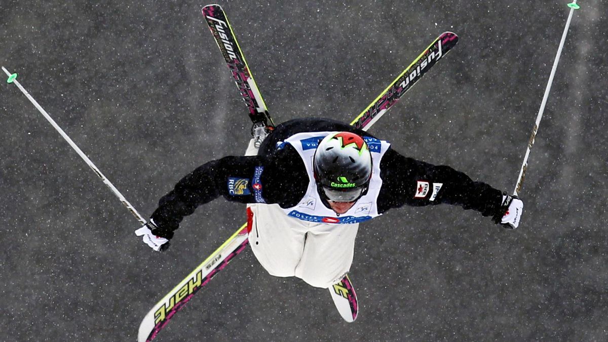 Canada's Alexandre Bilodeau flies through the air as he skis to a first place finish in the men's dual moguls at the World Cup freestyle ski competition at Mont Gabriel in Sainte-Adele, Quebec, January 15, 2011