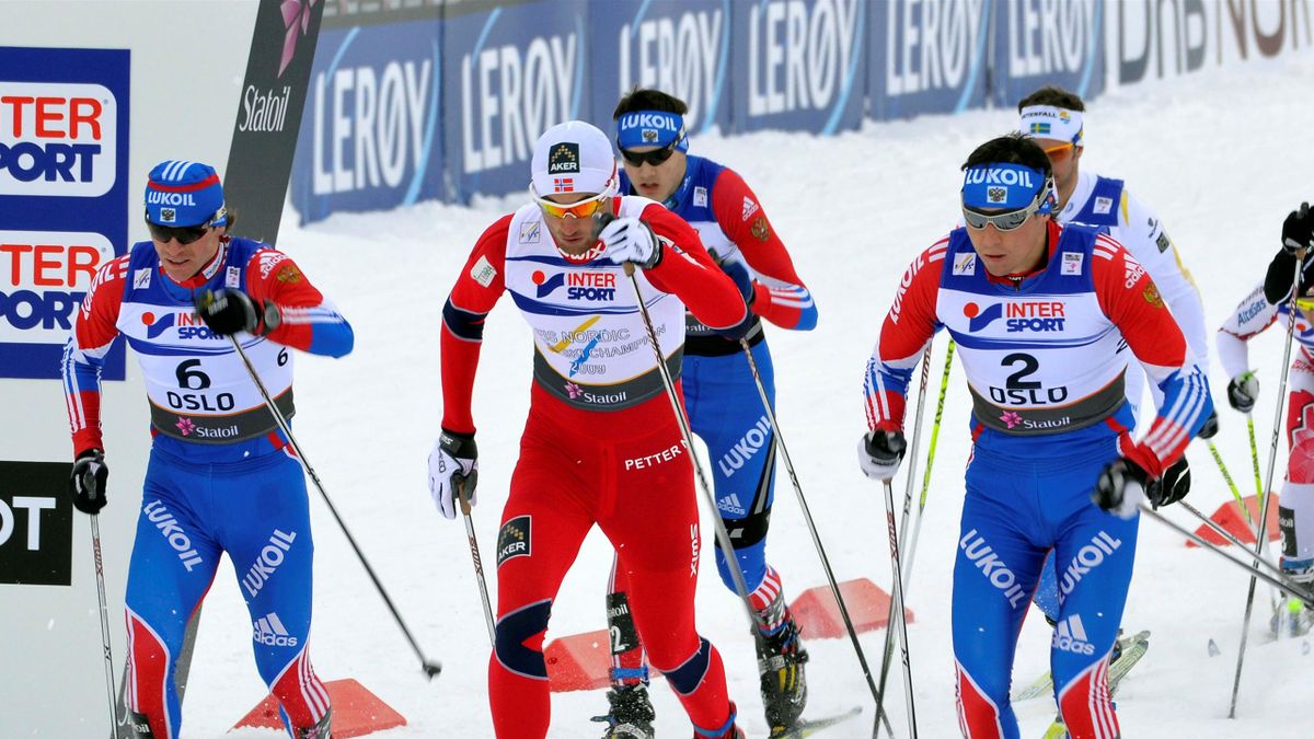Norway's Petter Northug, center, flanked by Russians Alexander Legkov, right, and Maxim Vylegzhanin in action at the start of the 30km pursuit race for men at the FIS Nordic World Ski Championships in the Holmenkollen Ski Arena, Oslo. Sunday Feb. 27, 2011