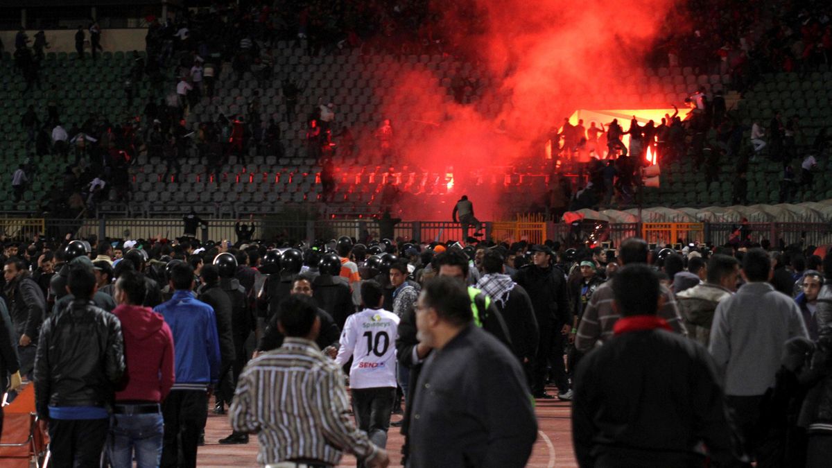 Soccer fans flee from a fire at Port Said Stadium February 1, 2012. Seventy-three people were killed and at least 1,000 injured on Wednesday after a soccer pitch invasion in the Egyptian city of Port Said, a health ministry official said, in an incident t