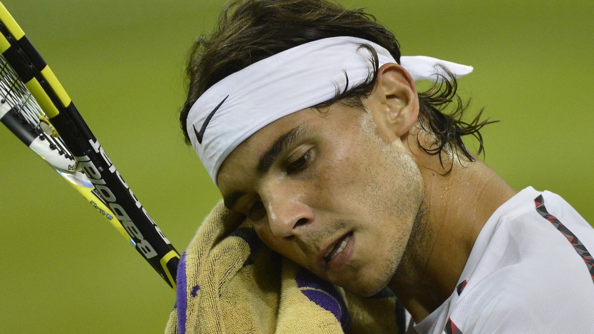 TENNIS Rafael Nadal of Spain wipes his face in his men's singles tennis match against Lukas Rosol of the Czech Republic at the Wimbledon tennis championships in London June 28, 2012.