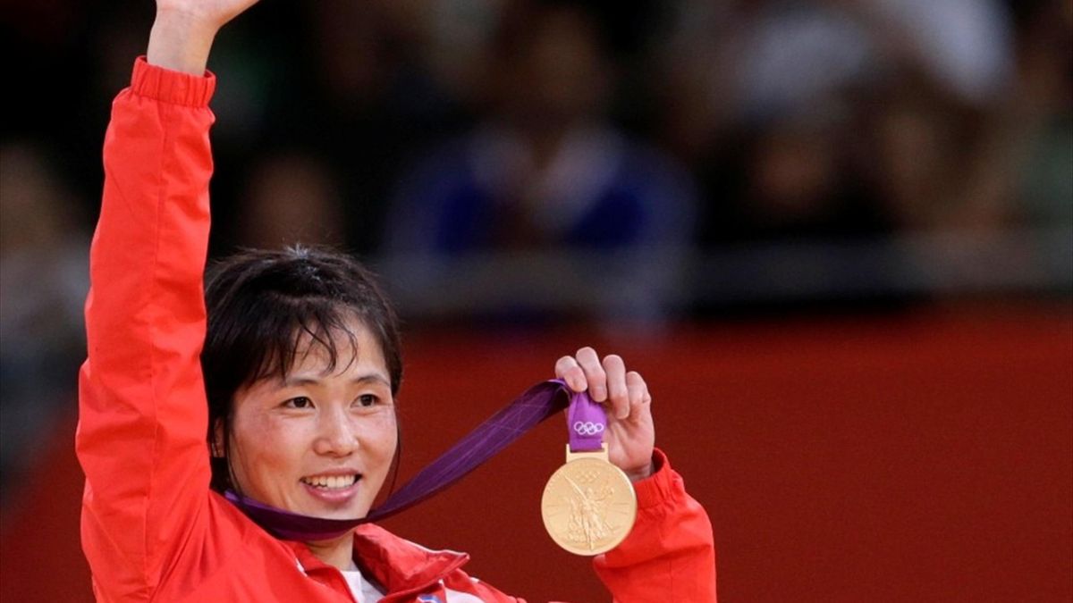 North Korea's An Kum Ae celebrates her gold medal victory during the awards ceremony for the women's -52kg judo competition at the London 2012 Olympic Games (Reuters)