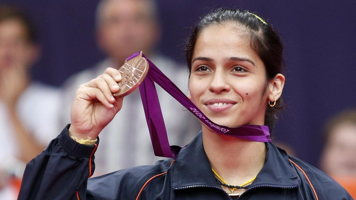 India's Saina Nehwal holds up her bronze medal at the women's singles badminton victory ceremony at the London 2012 Olympic Games at the Wembley Arena August 4, 2012 (Reuters)