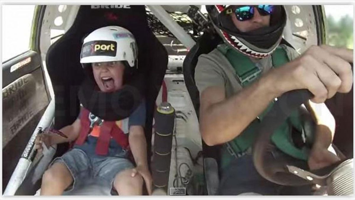 What happens when a father drives his five-year-old son round a track at top speed? Watch this face!