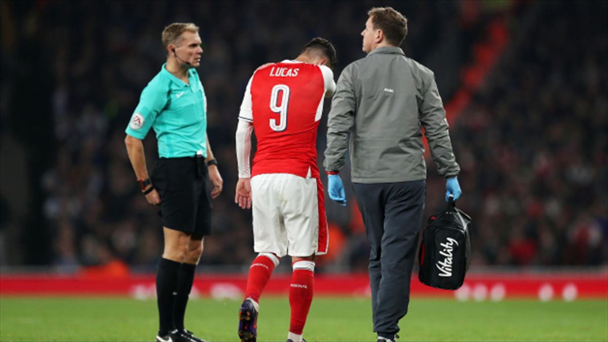 Arsenal's Lucas Perez leaves the pitch injured during the Reading game