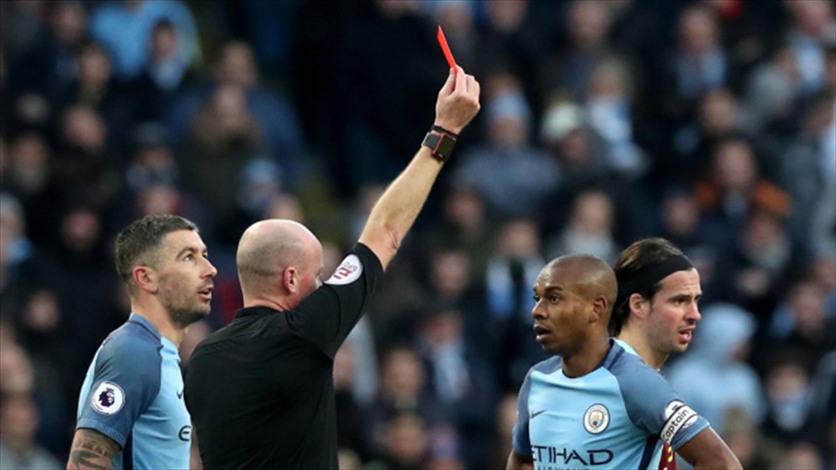 Manchester City's Fernandinho is shown the red card by referee Lee Mason