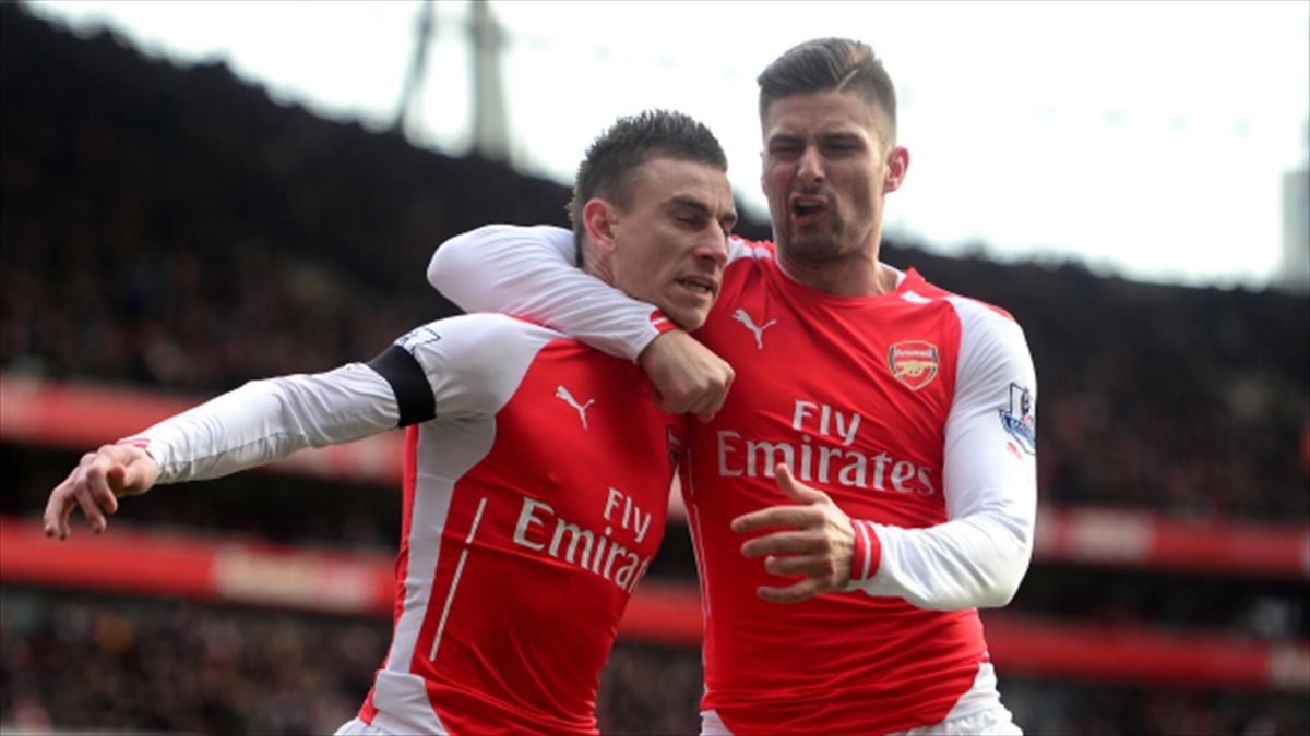 Arsenal duo Laurent Koscielny (left) and  Olivier Giroud (right) have both signed contract extensions, along with midfielder Francis Coquelin