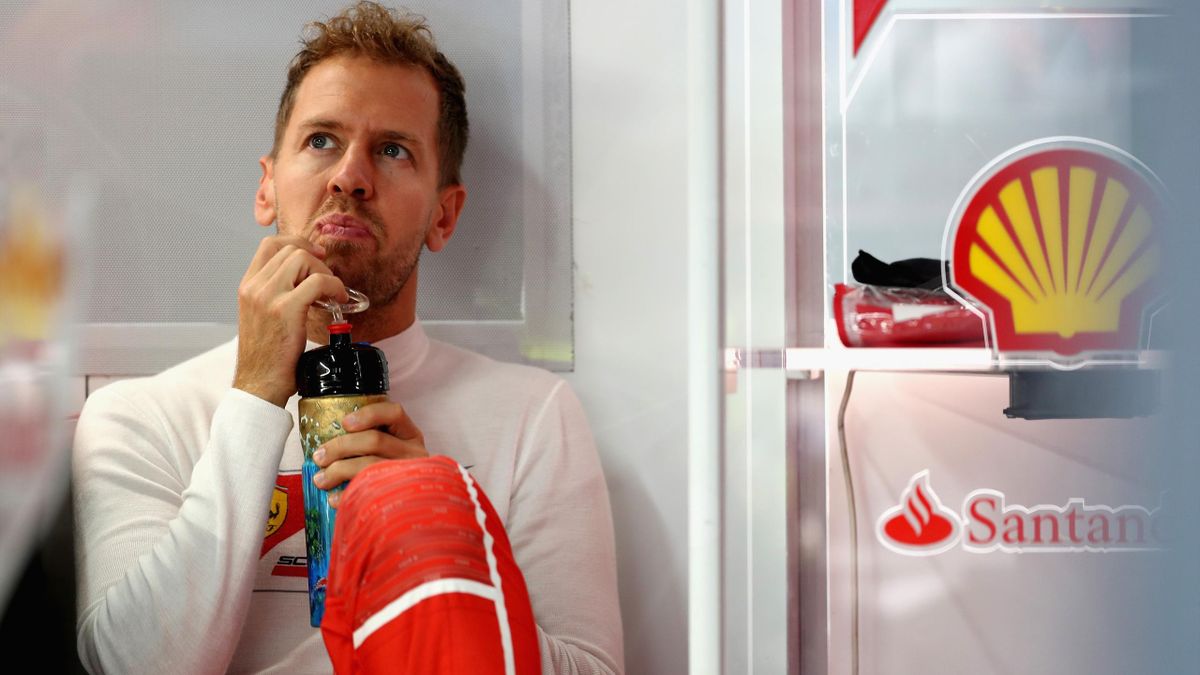 Sebastian Vettel of Germany and Ferrari prepares to drive in the garage during practice for the Formula One Grand Prix of Japan at Suzuka Circuit on October 6, 2017 in Suzuka.