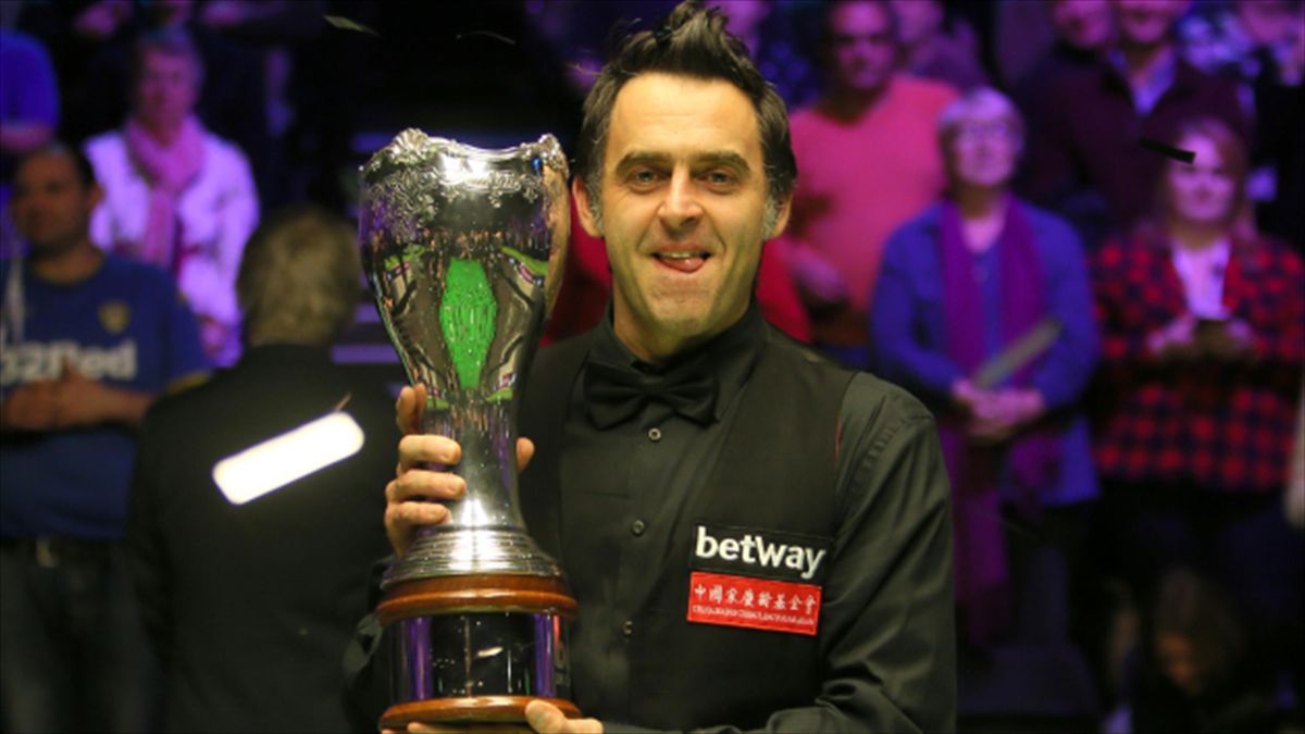 Ronnie O'Sullivan poses with the trophy after winning the Betway UK Championship