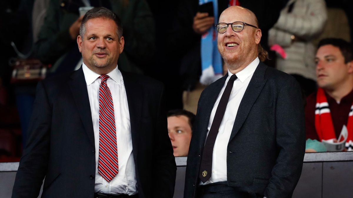Manchester United co-chairman Avram Glazer (right) pictured at a match at Old Trafford