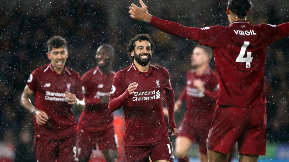Liverpool’s Mohamed Salah (centre) celebrates. (PA)
