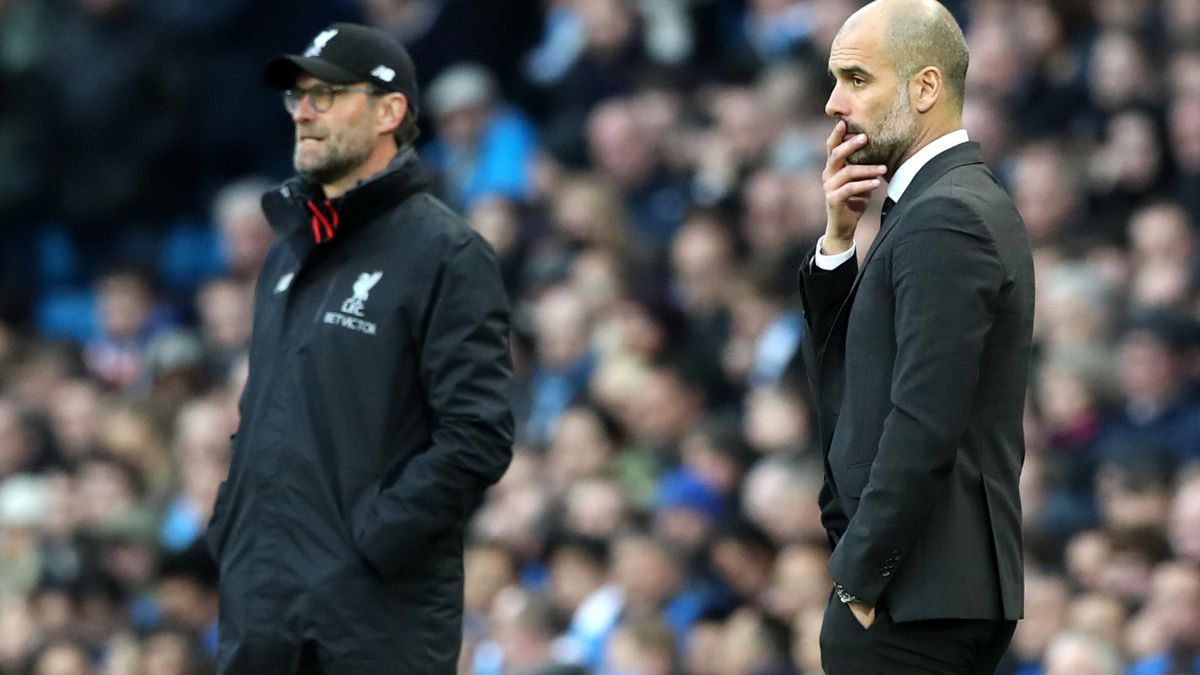 Can Jurgen Klopp's Liverpool hold off the challenge of Manchester City boss Pep Guardiola (right) (Martin Rickett/PA)