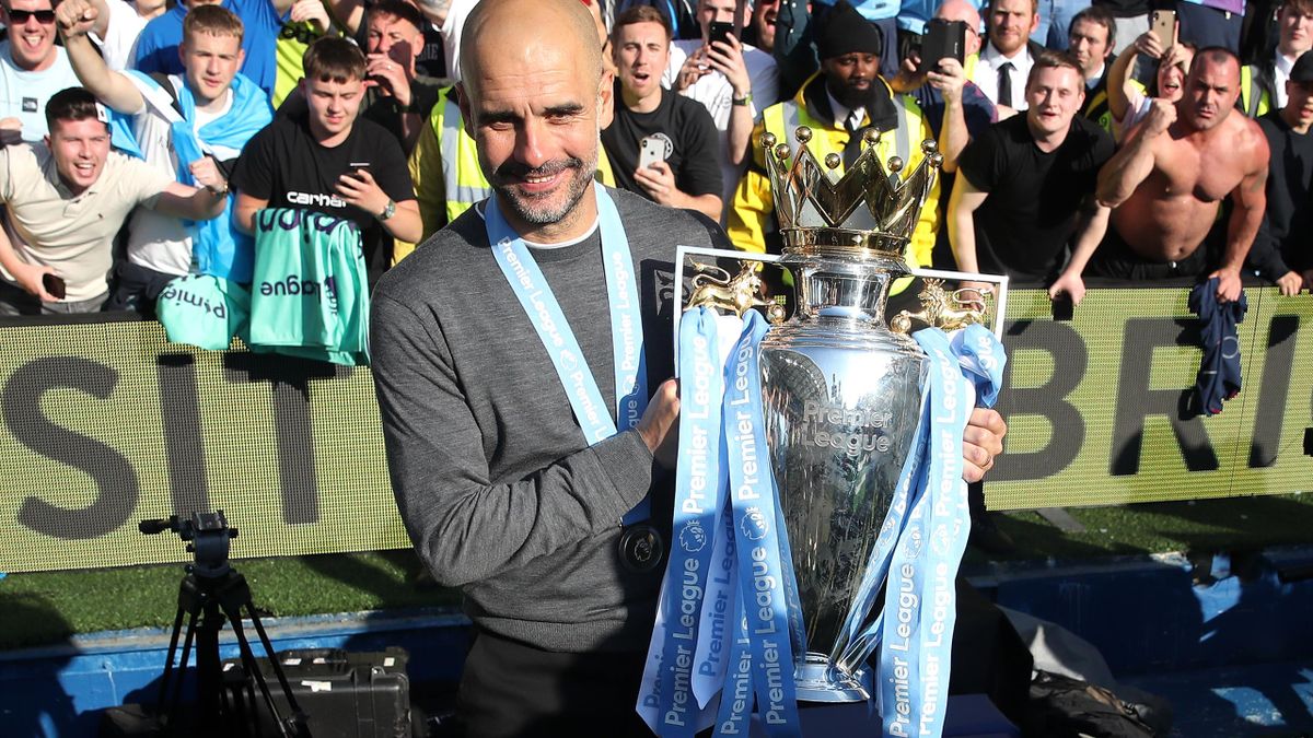 Pep Guardiola celebrates Manchester City's title defence