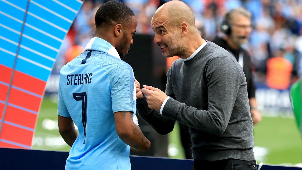Pep Guardiola, right, has a word with Raheem Sterling