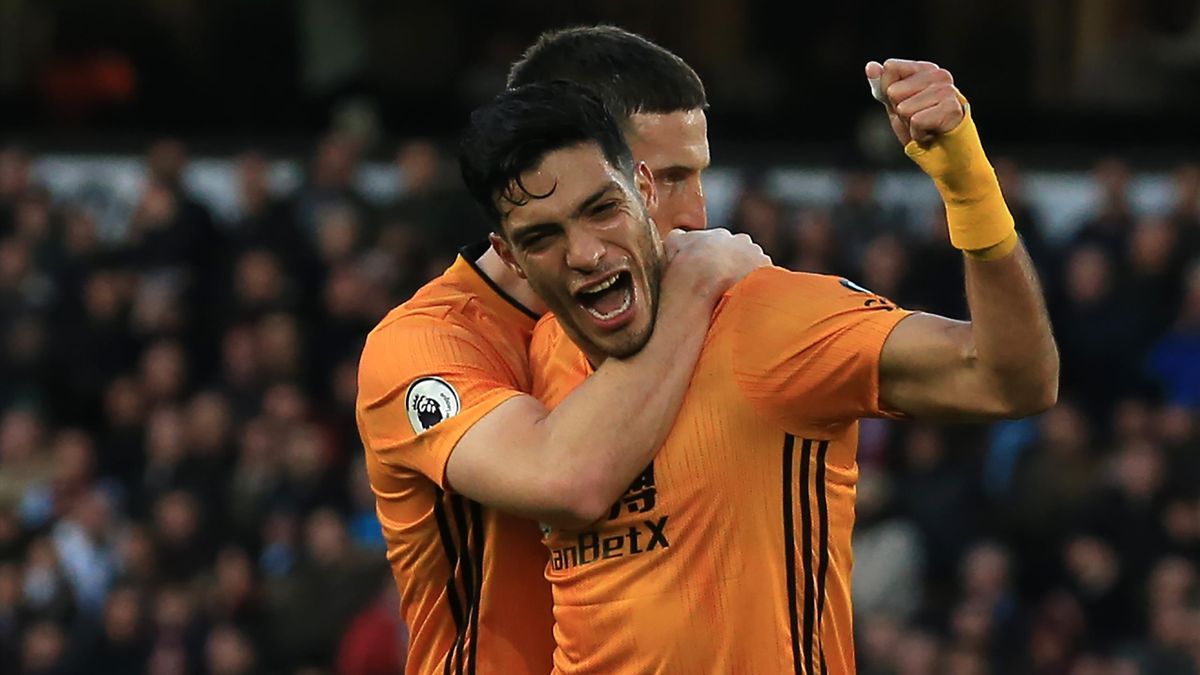 Wolverhampton Wanderers' Mexican striker Raul Jimenez (R) celebrates with Wolverhampton Wanderers' Irish defender Matt Doherty (L) after scoring their second goal during the English Premier League football match between Wolverhampton Wanderers and Aston V