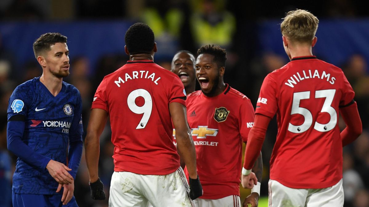 Anthony Martial of Manchester United celebrates after scoring his sides first goal with team mates during the Premier League match between Chelsea FC and Manchester United at Stamford Bridge on February 17, 2020 in London, United Kingdom.