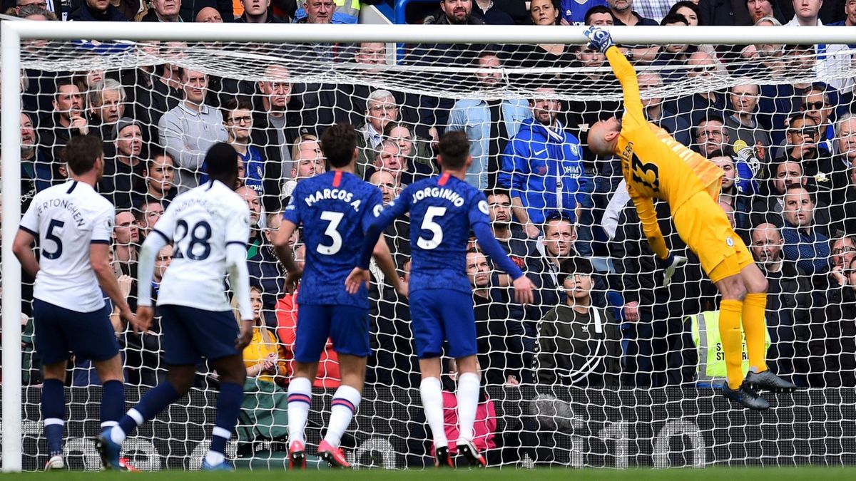 Chelsea's Argentinian goalkeeper Willy Caballero (R) tips the ball over the bar during the English Premier League football match between Chelsea and Tottenham Hotspur at Stamford Bridge in London on February 22 2020