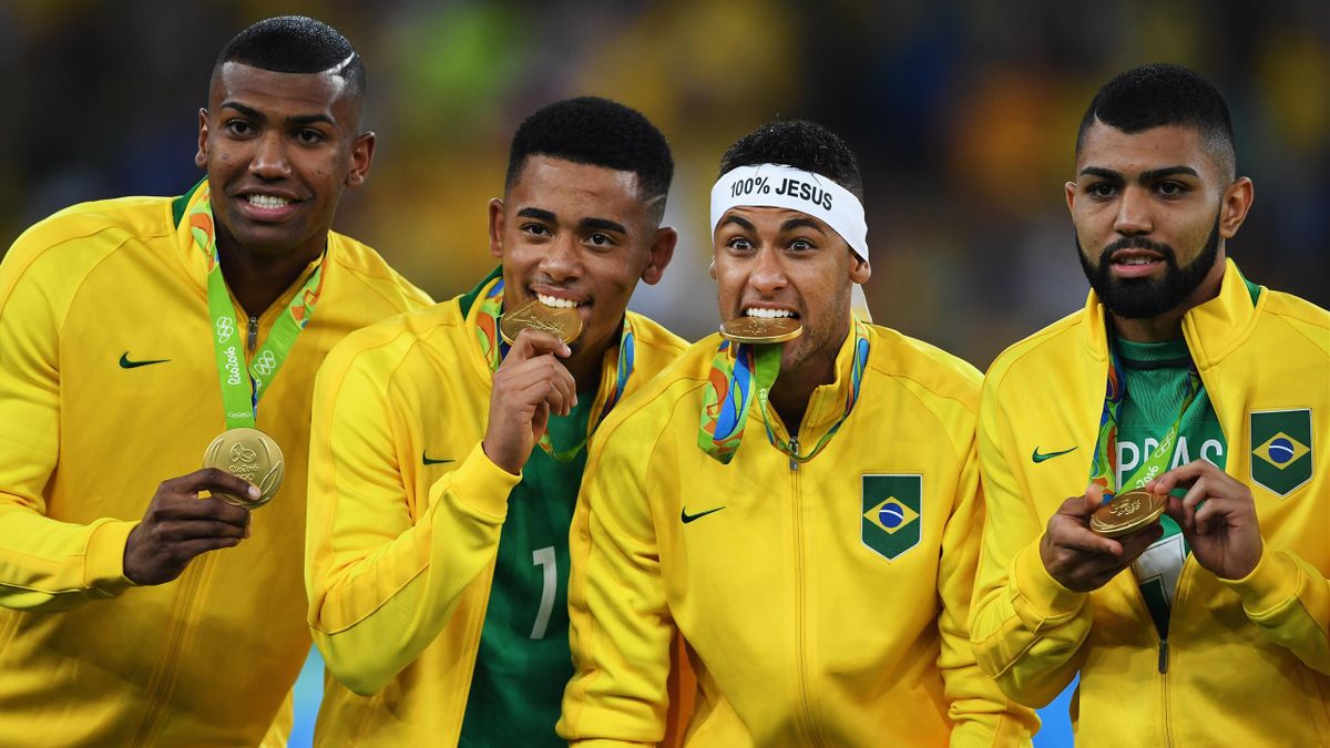 Neymar of Brazil bites his medal after the Olympic Men's Final Football match between Brazil and Germany at Maracana Stadium on August 20, 2016 in Rio de Janeiro, Brazil
