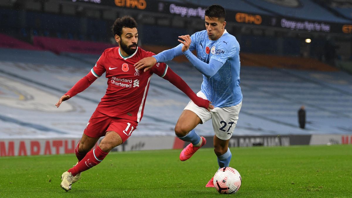 Manchester City's Joao Cancelo heads the ball during the Champions