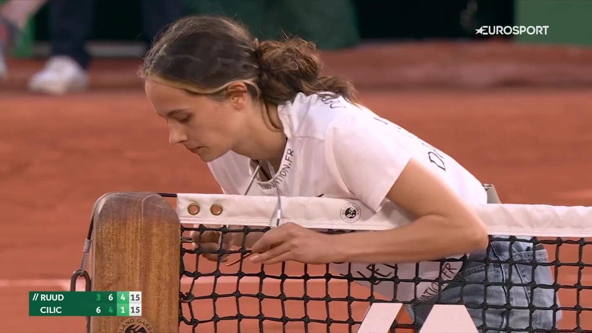 Shocking scenes - Protester ties herself to net causing delay in French Open match between Casper Ruud and Marin Cilic