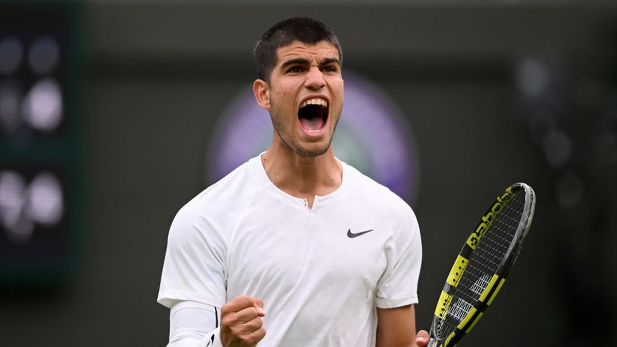 Carlos Alcaraz of Spain celebrates match point against Jan-Lennard Struff of Germany during the Men's Singles First Round match during Day One of The Championships Wimbledon 2022 at All England Lawn Tennis and Croquet Club on June 27, 2022 in London, Engl