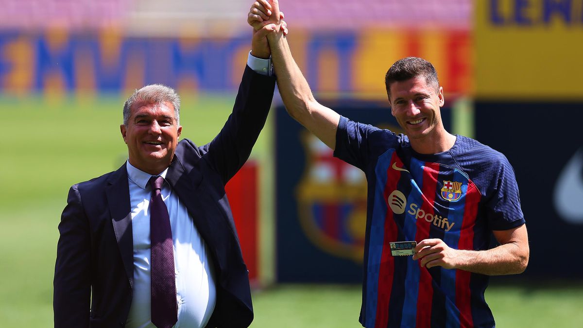 Robert Lewandowski and Joan Laporta poses for the media as Lewandowski is presented as a FC Barcelona player at Camp Nou on August 05, 2022 in Barcelona, Spain.