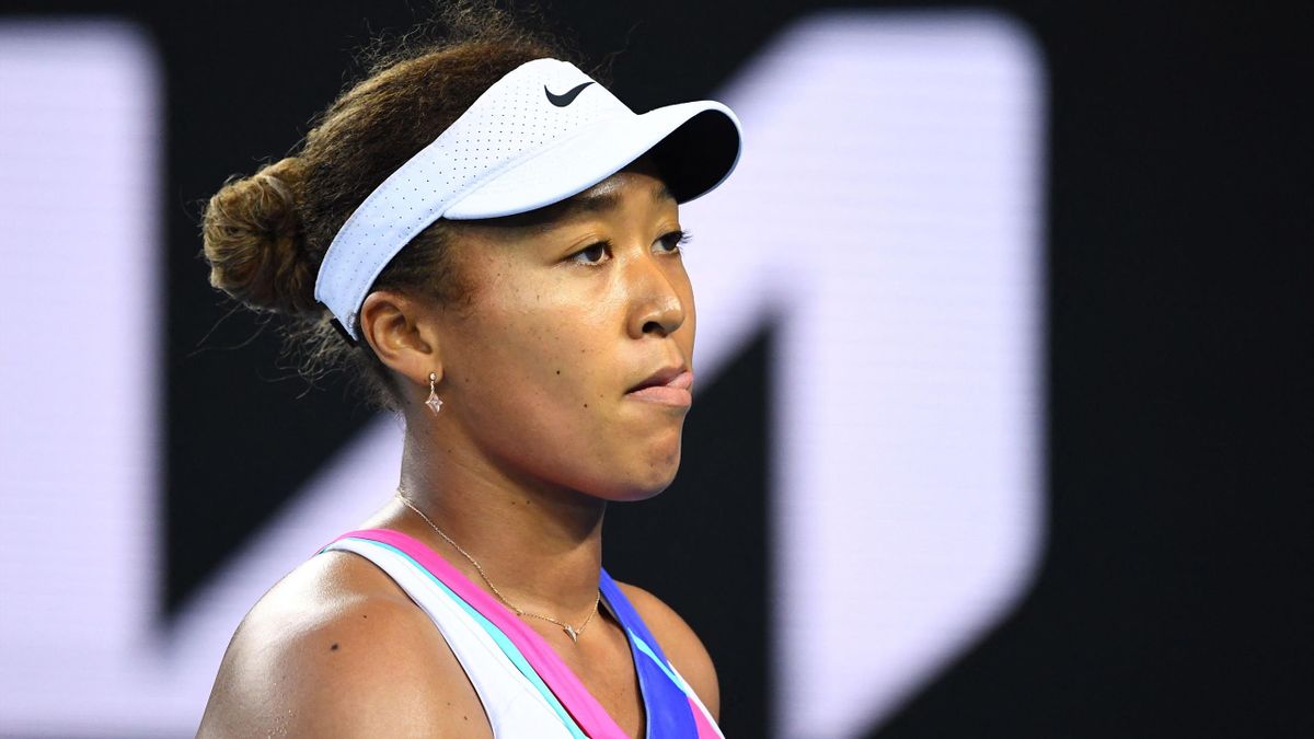 Japan's Naomi Osaka reacts as she plays against Amanda Anisimova of the US during their women's singles match on day five of the Australian Open tennis tournament in Melbourne on January 21, 2022