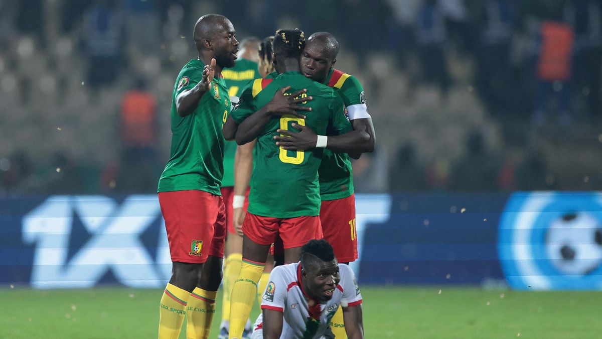 Cameroon's forward Vincent Aboubakar (R) celebrates with teammates after scoring a goal during the Africa Cup of Nations (CAN) 2021 third place football match between Burkina Faso and Cameroon at Stade Ahmadou-Ahidjo in Yaounde on February 5, 2022.