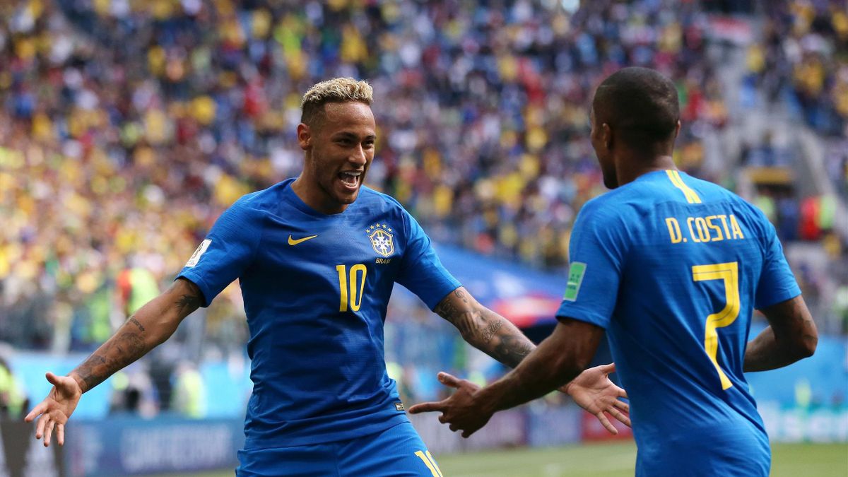 Neymar Jr of Brazil celebrates with teammate Douglas Costa after scoring his team's second goal during the 2018 FIFA World Cup Russia group E match between Brazil and Costa Rica at Saint Petersburg Stadium on June 22, 2018 in Saint Petersburg, Russia.