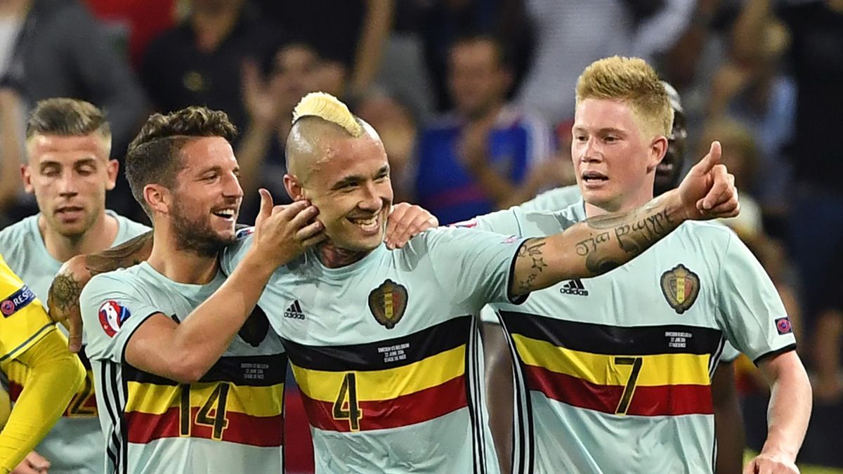 Belgium's midfielder Radja Nainggolan (C) celebrates a goal with Belgium's forward Dries Mertens (2nd L) and Belgium's midfielder Kevin De Bruyne (R) during the Euro 2016 group E football match between Sweden and Belgium at the Allianz Riviera stadium in