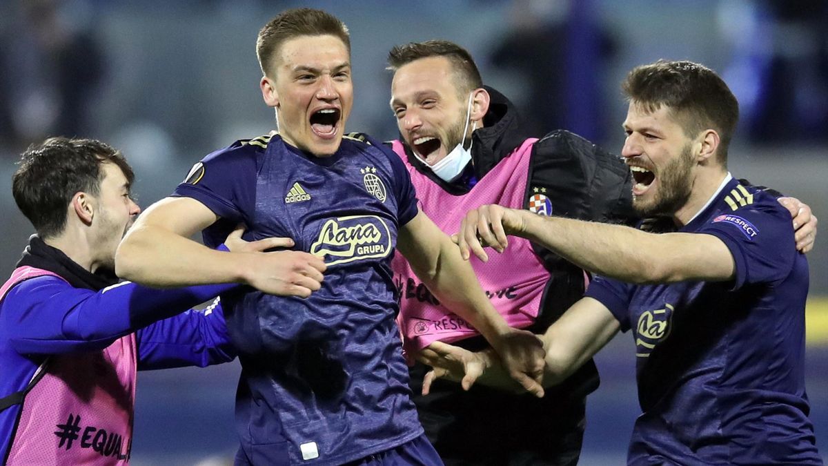 Dinamo Zagreb's players celebrate their 3-0 victory at the end of the UEFA Europa League round of 16