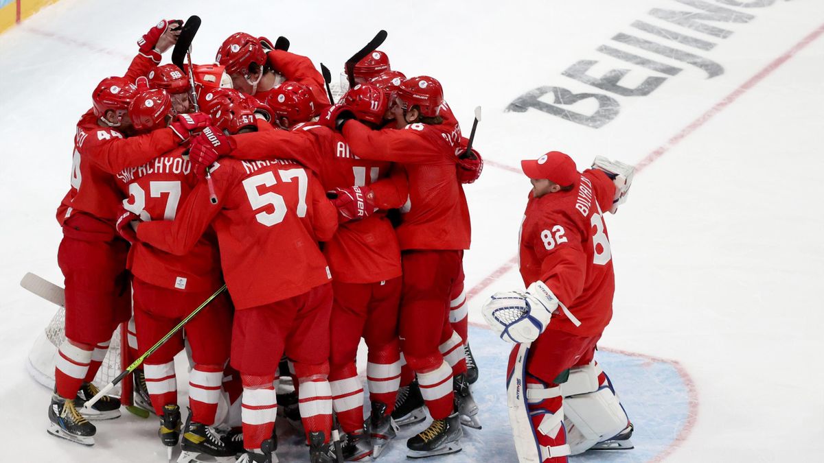ROC's players celebrate winning their men's semi-final ice hockey match against Sweden during the Beijing 2022 Winter Olympic Games