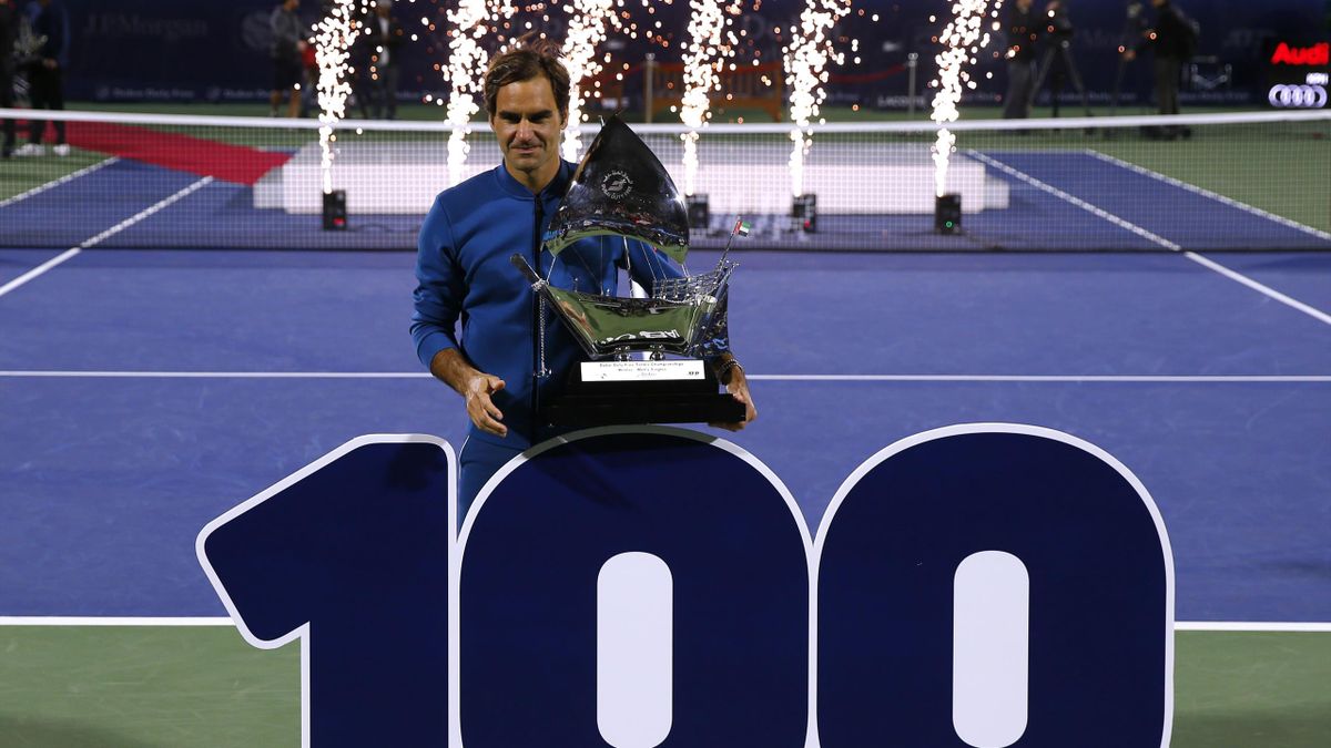 Rodger Federer of Switzerland poses with the winners trophy after victory during day fourteen of the Dubai Duty Free Championships at Tennis Stadium on March 02, 2019 in Dubai, United Arab Emirates