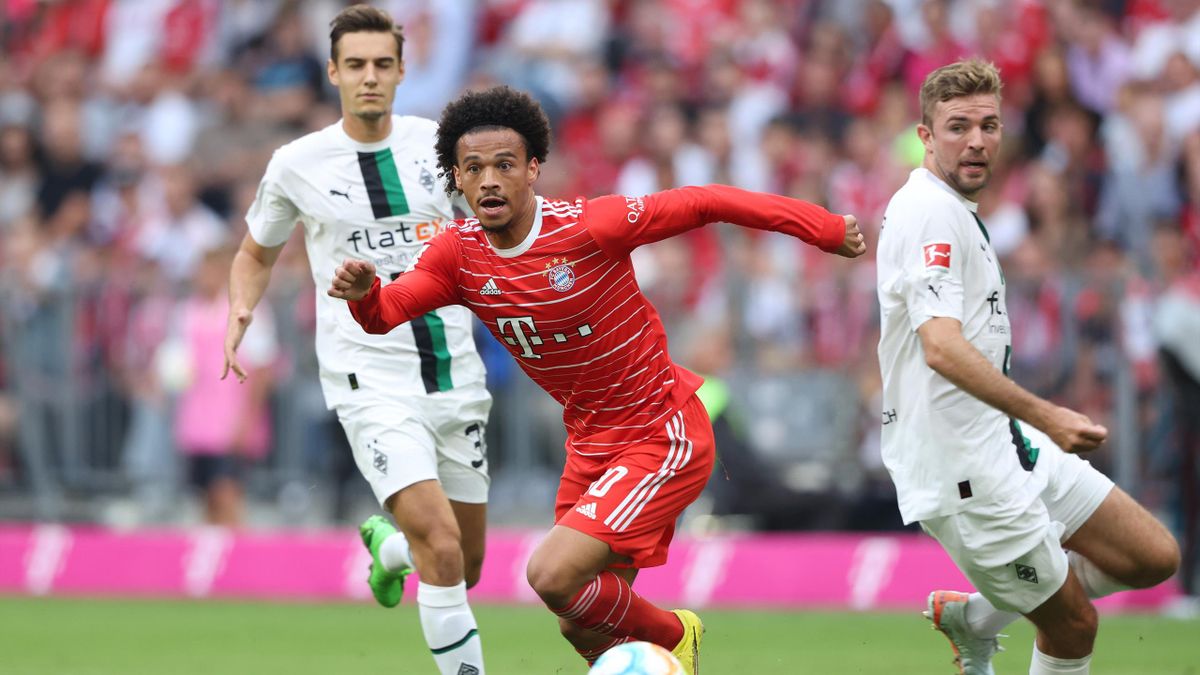 Leroy Sane of Bayern Munich is put under pressure by Christoph Kramer of Borussia Monchengladbach during the Bundesliga match between FC Bayern München and Borussia Mönchengladbach at Allianz Arena