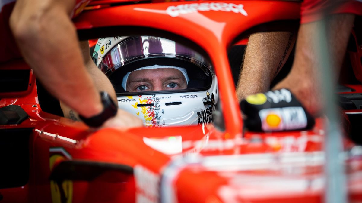 TOPSHOT - Ferrari's German driver Sebastian Vettel gets ready to attend a practice session for the Formula One Japanese Grand Prix at Suzuka on October 5, 2018