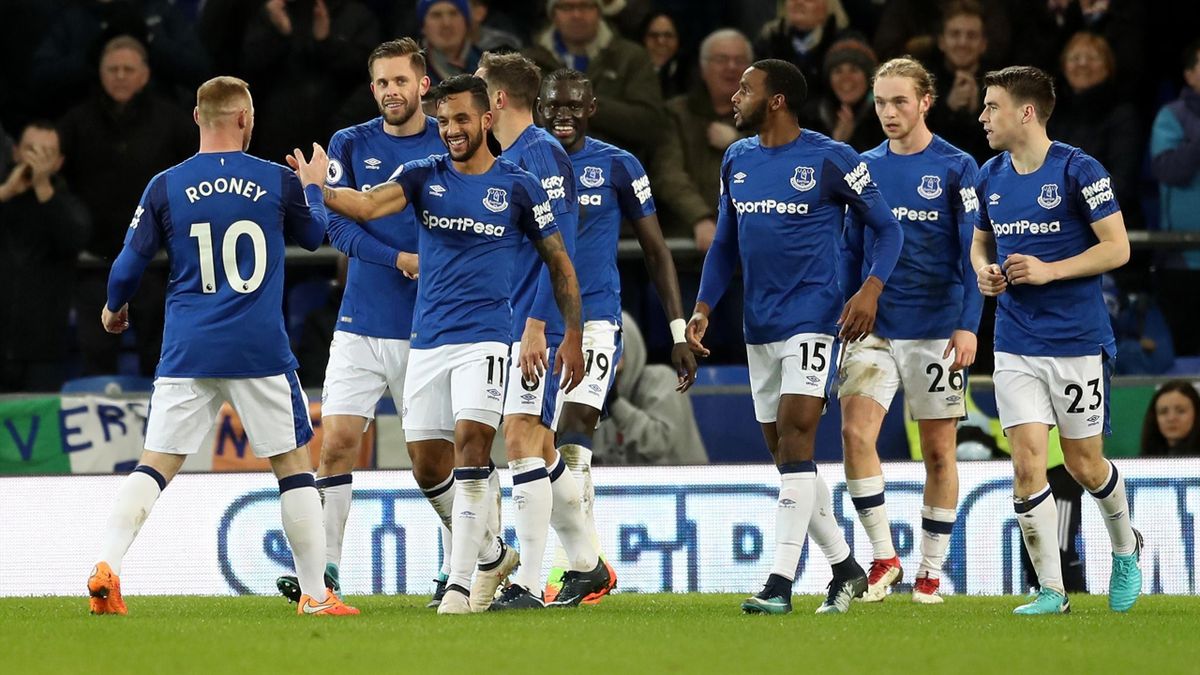 Theo Walcott of Everton celebrates after scoring his sides second goal with his team mates during the Premier League match between Everton and Leicester City at Goodison Park.