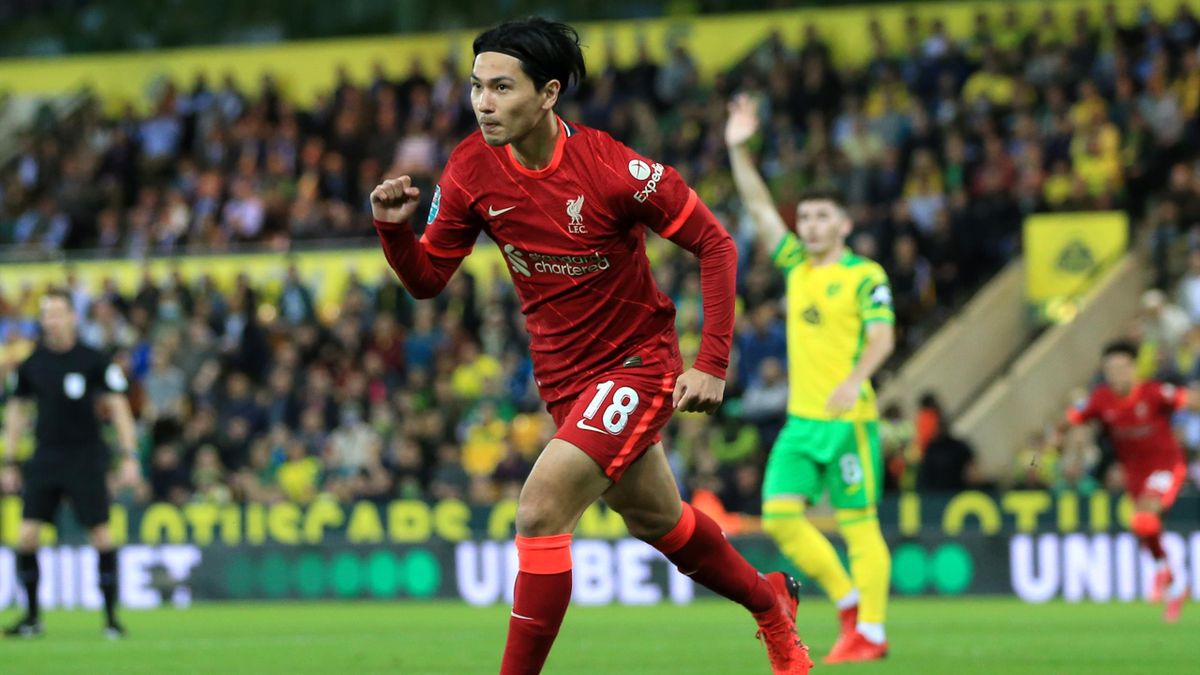 Takumi Minamino of Liverpool celebrates after scoring their sides first goal during the Carabao Cup Third Round match between Norwich City and Liverpool at Carrow Road on September 21, 2021 in Norwich, England