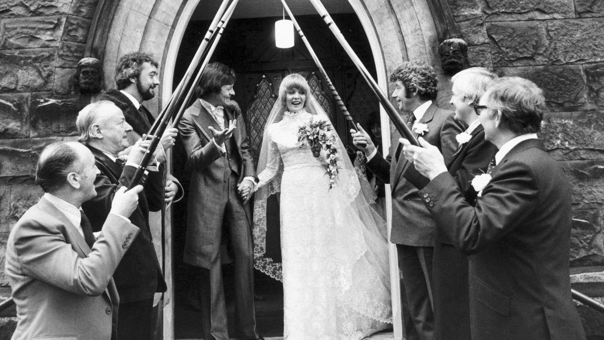 Alex Higgins celebrates getting married to Lynn in 1980.