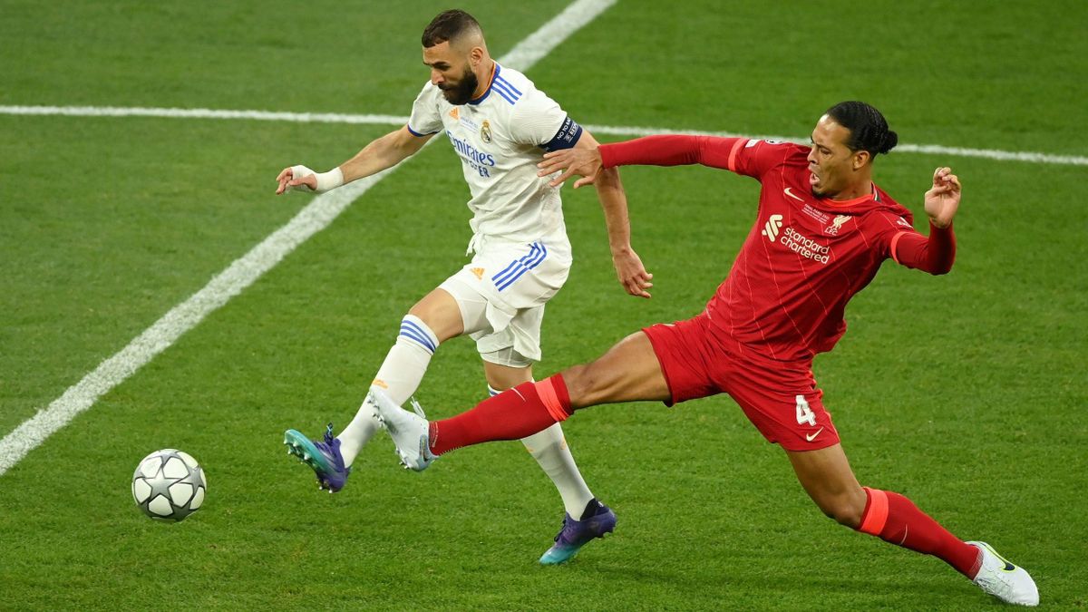 Karim Benzema of Real Madrid is challenged by Virgil van Dijk of Liverpool during the UEFA Champions League final match between Liverpool FC and Real Madrid at Stade de France on May 28, 2022