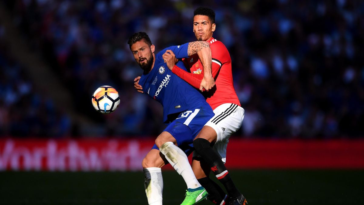 Olivier Giroud of Chelsea is challenged by Chris Smalling of Manchester United during The Emirates FA Cup Final between Chelsea and Manchester United