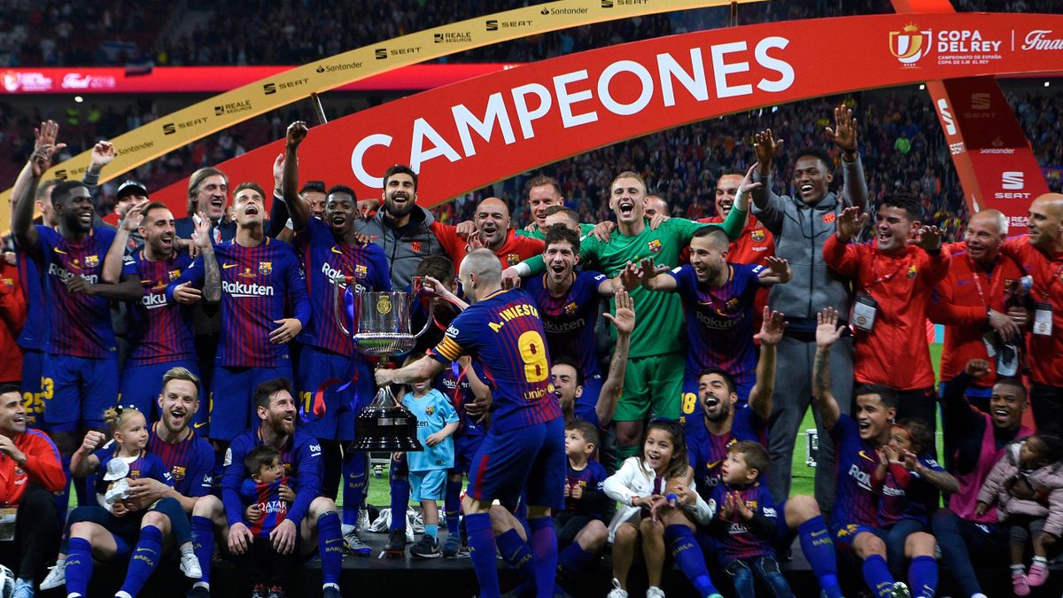 Barcelona's players pose with the trophy after winning the Spanish Copa del Rey
