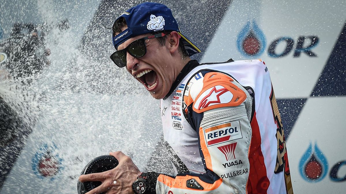Repsol Honda Team Spanish rider Marc Marquez celebrates on the podium after winning the MotoGP race for the Thailand Grand Prix at Buriram International Circuit in Buriram on October 6, 2019