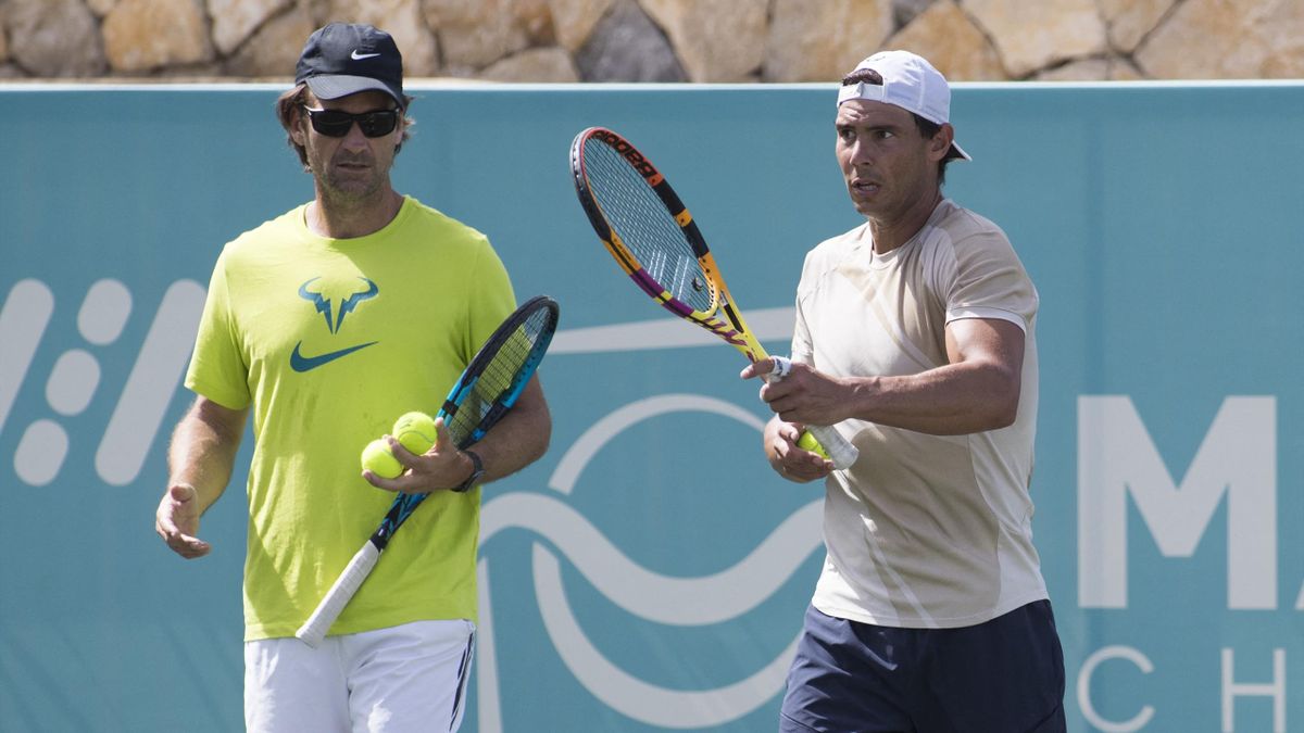 Rafael Nadal (R) and his Spanish coach Carlos Moya take part in a training session at Santa Ponsa Country Club in Santa Ponsa, on the Spanish Balearic Island of Mallorca, on June 17, 2022