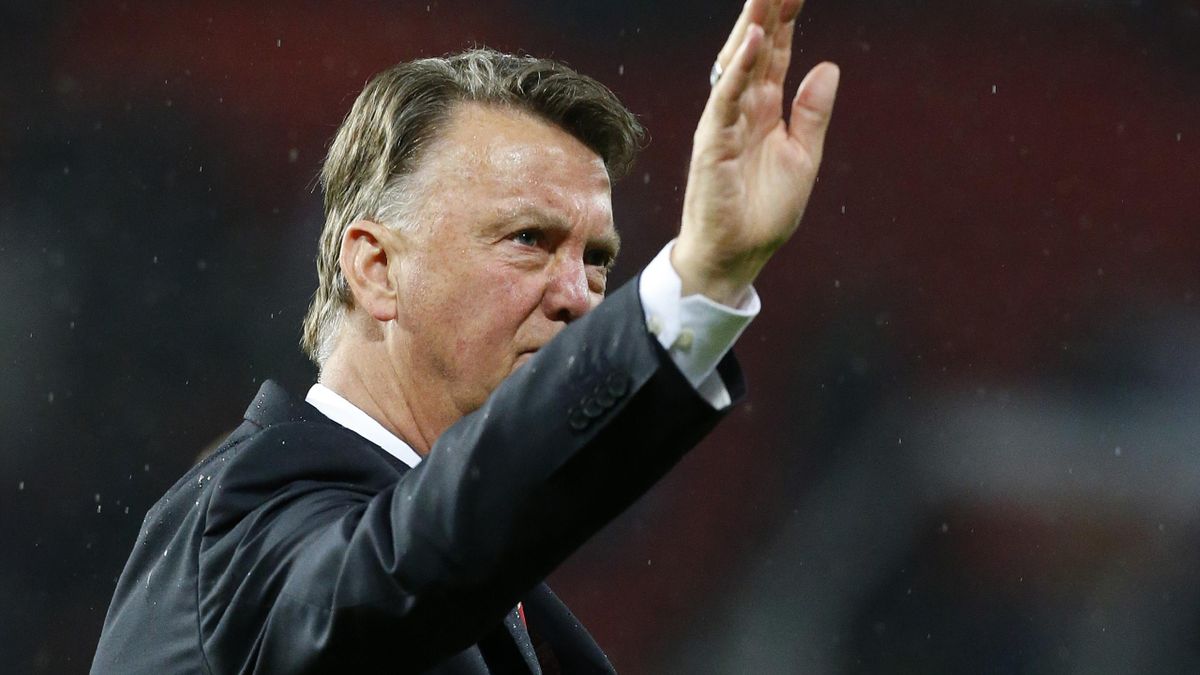 Manchester United's Dutch manager Louis van Gaal waves to the fans