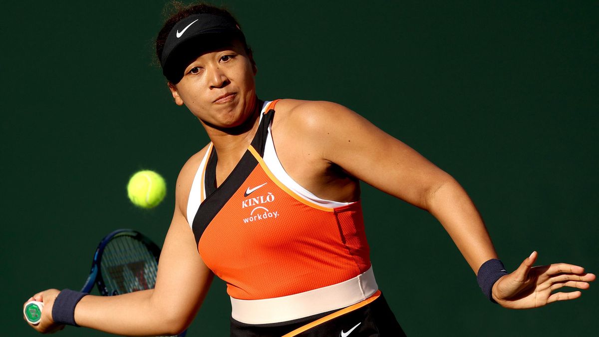 Naomi Osaka of Japan returns a shot to Sloane Stephens during the BNP Paribas Open at Indian Wells