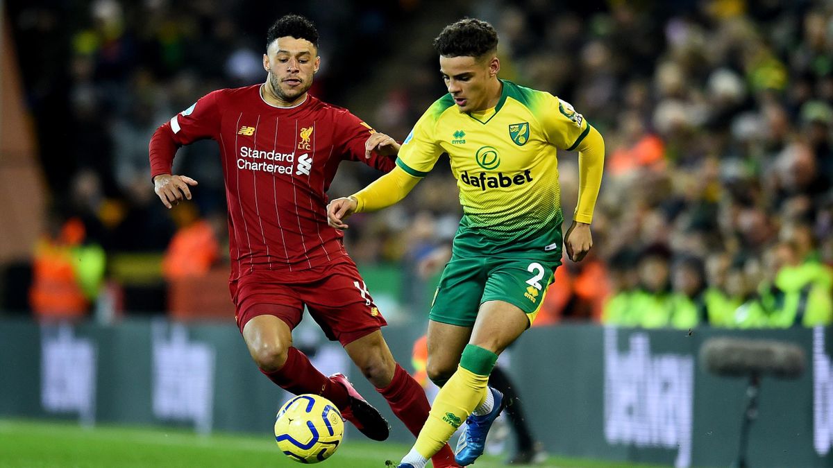 Alex Oxlade-Chamberlain of Liverpool with Max Aarons of Norwich City during the Premier League match between Norwich City and Liverpool FC at Carrow Road on February 15, 2020 in Norwich, United Kingdom.
