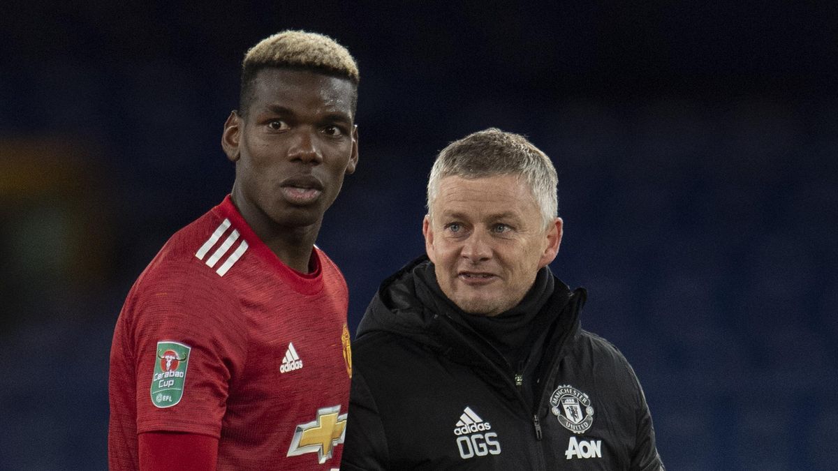 Paul Pogba of Manchester United and Manager Ole Gunnar Solskjær after the Carabao Cup Quarter Final match between Everton and Manchester United at Goodison Park on December 23, 2020 in Liverpool, England.