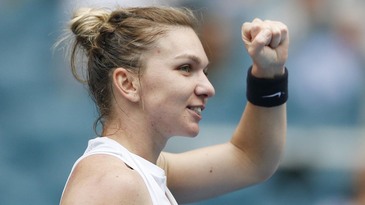 Simona Halep of Romania celebrates after defeating Polona Hercog of Slovenia on Day 7 of the Miami Open Presented by Itau at Hard Rock Stadium on March 24, 2019 in Miami Gardens, Florida